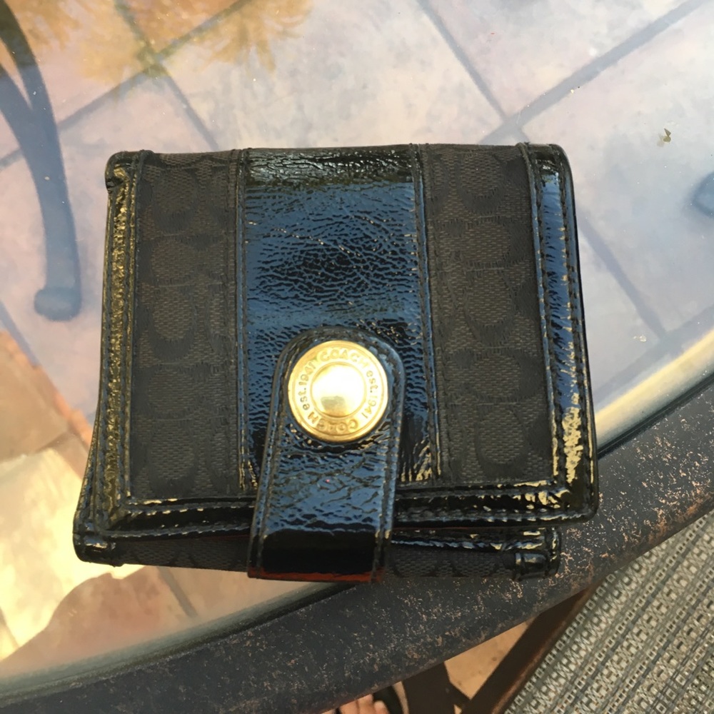 Used 4 inch by 4 1/2 inch Coach black wallet
